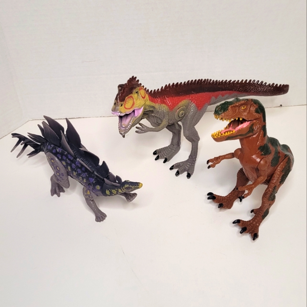 Three Dinosaurs Two with Jointed Limbs and Ine with Sound Action Figures